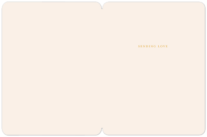 Inside of a get well greeting card, light cream colored, with the gold text 'SENDING LOVE' in the upper right corner.
