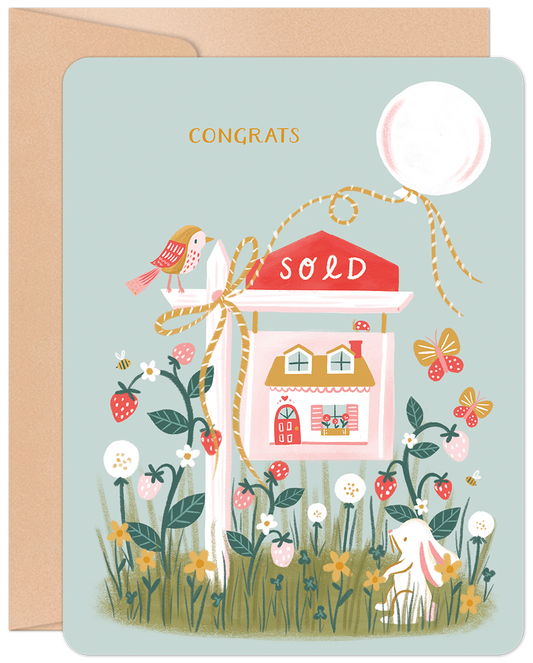 Whimsical new home card with 'CONGRATS', a 'SOLD' sign, a house, rabbit, bird, strawberries, and flowers on a light blue background.