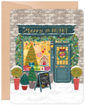 Illustrated holiday greeting card featuring a charming winter storefront adorned with festive garlands, a glowing 'Merry and Bright' sign, a decorated Christmas tree, gingerbread house, and gifts in a snowy setting.