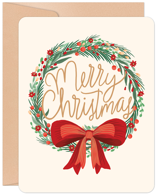 Front of a 'Merry Christmas' greeting card featuring a festive wreath with red berries, green foliage, and a large red bow.