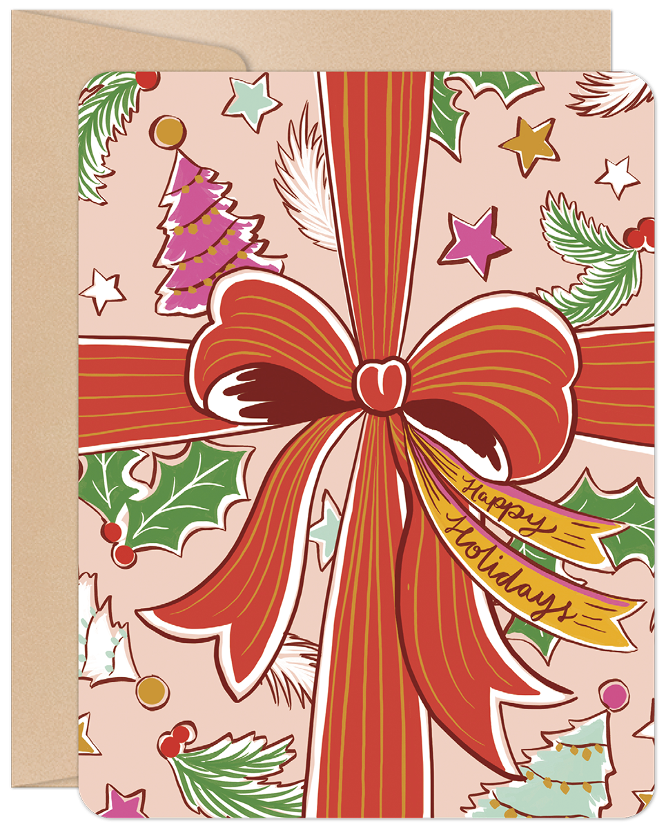 Front of a festive pink Christmas card with a large red bow, 'Happy Holidays' tag, evergreen branches, stars, and colorful Christmas trees.