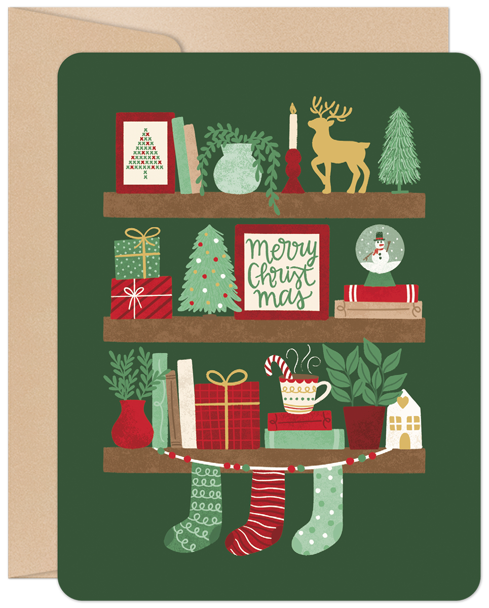 Front of a festive green holiday greeting card featuring three decorated shelves with charming illustrations of gifts, mini Christmas trees, a reindeer, snowman globe, candles, mugs, and stockings, perfect for spreading cheer.