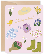 Cute spring greeting card for children featuring a yellow chick, daffodil, mimosa, violets, cherry blossoms, tulips, straw hat, rain boots, and watering can on a pink background, with 'Spring is here!' text. Perfect for a young recipient's seasonal joy.