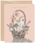 Elegant Easter greeting card featuring a watercolor illustration of a spring floral basket with pink orchids, white tulips, and green foliage on a pale pink background, with 'HAPPY EASTER' in gold text.