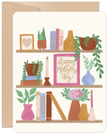 Illustrated Mother's Day greeting card featuring a charming bookshelf with potted plants, colorful books (Recipes, Poetry, Gardening), and a framed message 'Happy Mother's Day' in elegant script. Ideal for mom, wife, or grandma.