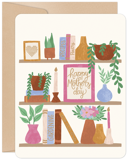Happy Mother's Day card featuring a charming bookshelf illustration with books, potted plants, and candles on a cream background.