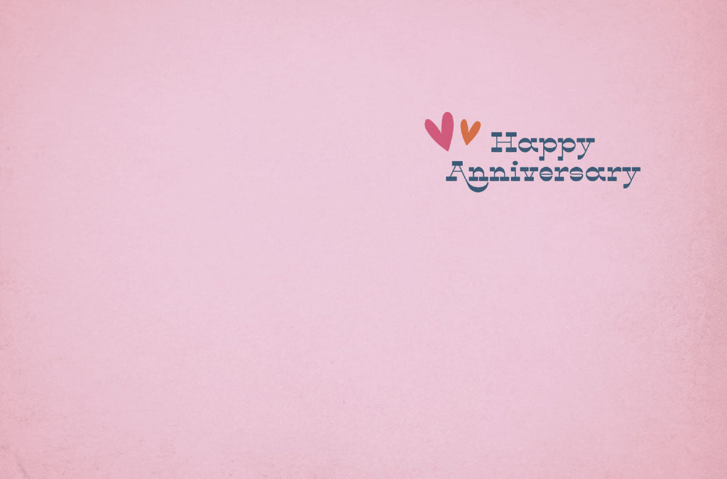 Inside of a romantic greeting card with a simple 'Happy Anniversary' message in blue text, accented by small pink and orange hearts, on a soft pink background. Perfect for a spouse.