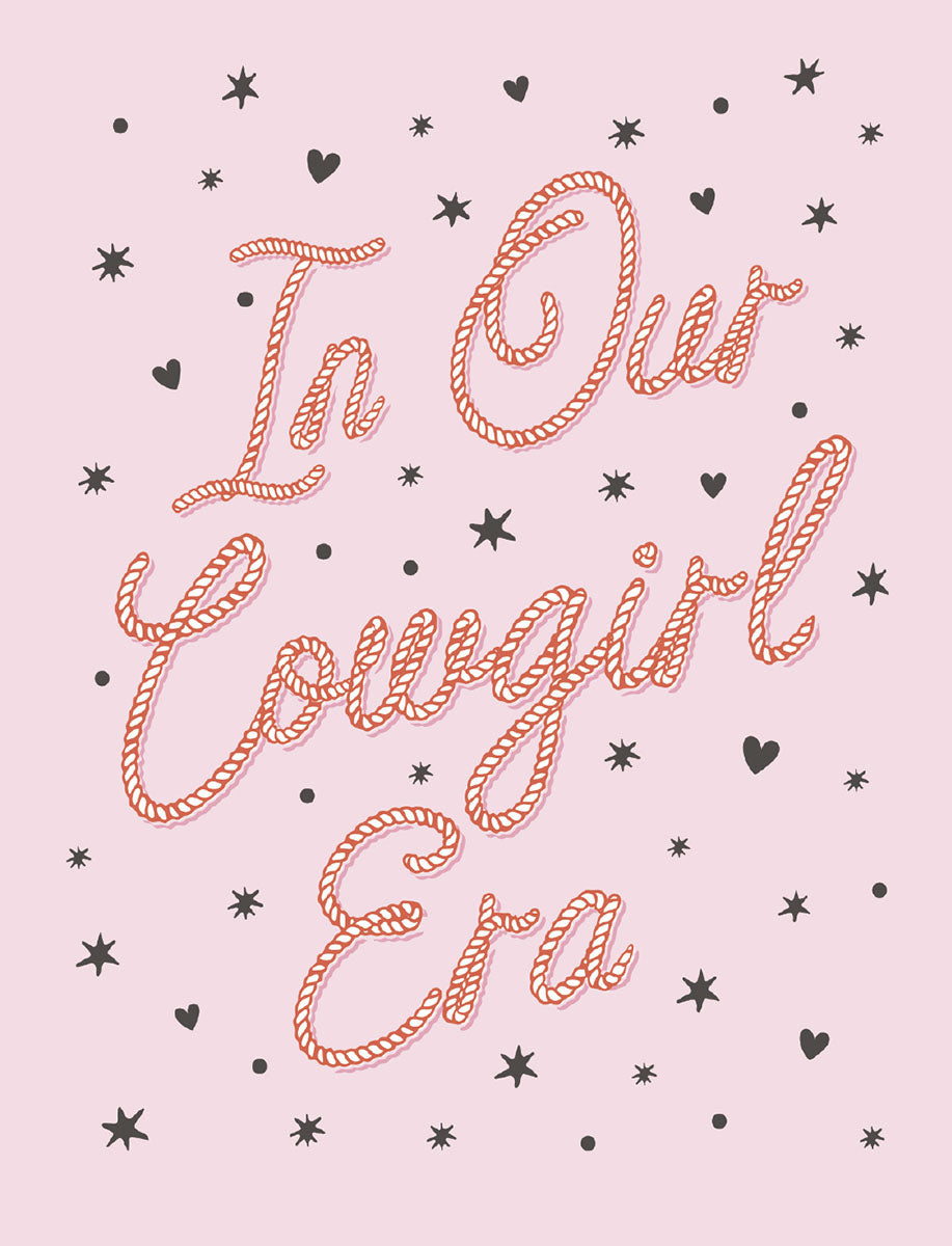 Front of a cute pink greeting card with rope-style text 'In Our Cowgirl Era' surrounded by black stars and hearts, perfect for her friend.
