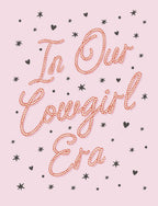 Front of a cute pink greeting card with rope-style text 'In Our Cowgirl Era' surrounded by black stars and hearts, perfect for her friend.