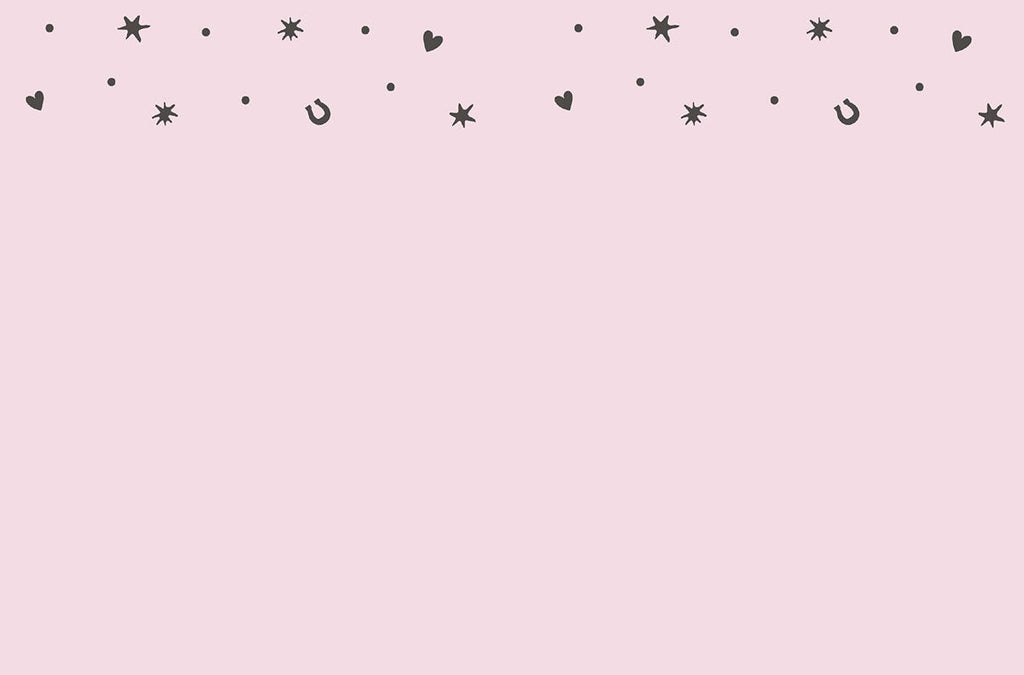 Inside of a light pink greeting card with a simple border of small black stars, hearts, and horseshoes, offering ample space for a personal message.