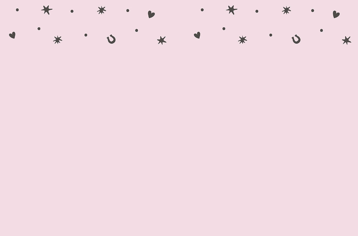 Inside of a light pink greeting card with a simple border of small black stars, hearts, and horseshoes, offering ample space for a personal message.