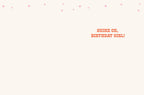 Inside of a white birthday greeting card with scattered pink stars, featuring the encouraging message 'SHINE ON, BIRTHDAY GIRL!' in bold red letters.