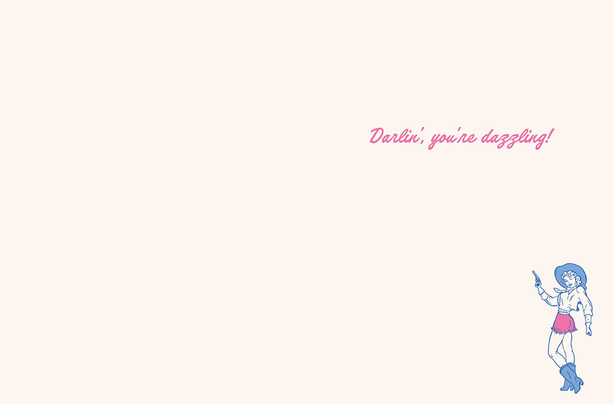 Inside of a friendship greeting card, showing a minimalist design with a faint pink background. The heartfelt message 'Darlin', you're dazzling!' is written in elegant script, with a small cowgirl illustration in the bottom right corner.