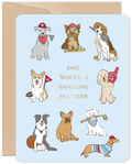 Front of a light blue Father's Day greeting card featuring various cartoon dogs dressed in sports outfits. Text reads 'DAD, YOU'RE A DOGGONE ALL-STAR' surrounded by a terrier in a baseball cap, a beagle with a tennis racket, a corgi with a football, a poodle with a foam finger, a border collie with a basketball, a golden retriever with a headband, a terrier with a hockey stick, and a dachshund in a striped shirt and baseball cap. The card has a brown envelope behind it.