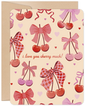 Cute romantic Valentine's Day card featuring a repeating pattern of red and pink cherries tied with decorative bows, tiny hearts, and the sweet handwritten text 'i love you cherry much!' on a light beige background.