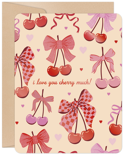 Front of a charming Valentine's Day card featuring 'I love you cherry much!' text amidst a delightful pattern of pink and red cherries and bows.