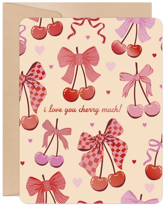 Front of a charming Valentine's Day card featuring 'I love you cherry much!' text amidst a delightful pattern of pink and red cherries and bows.