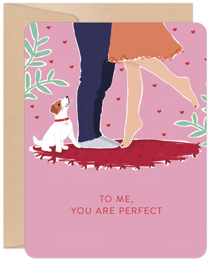 Front of romantic Valentine's Day card with a couple embracing and their dog, text reads 'To Me, You Are Perfect'.