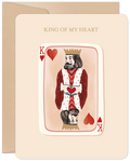 Romantic greeting card featuring a stylized King of Hearts playing card with a beard and crown, holding a heart, with the text 'KING OF MY HEART' at the top, on a light beige background with an envelope visible behind.