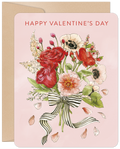 Front of a watercolor Valentine's Day greeting card featuring a lush bouquet of red roses, pink peonies, and white anemones tied with a black and white striped ribbon, set against a soft pink background with falling petals, all contained within a kraft envelope.