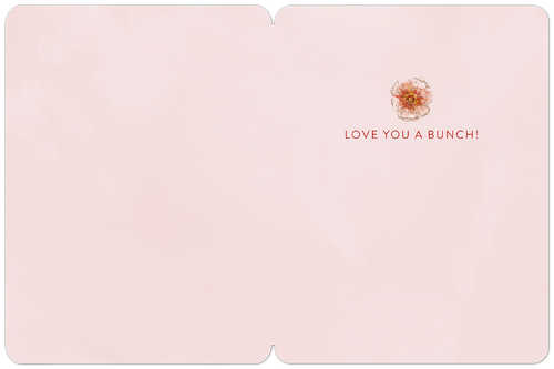 Inside of a romantic pale pink Valentine's Day card for a spouse, with a small watercolor flower detail and the loving message 'LOVE YOU A BUNCH!' on a smooth texture, ready for a personal note.