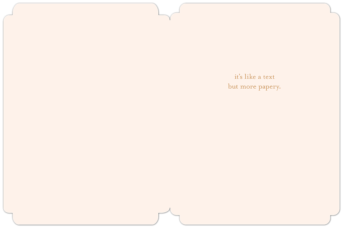 Open light pink greeting card interior revealing lighthearted text 'it's like a text but more papery.', perfect for a friend's special day.