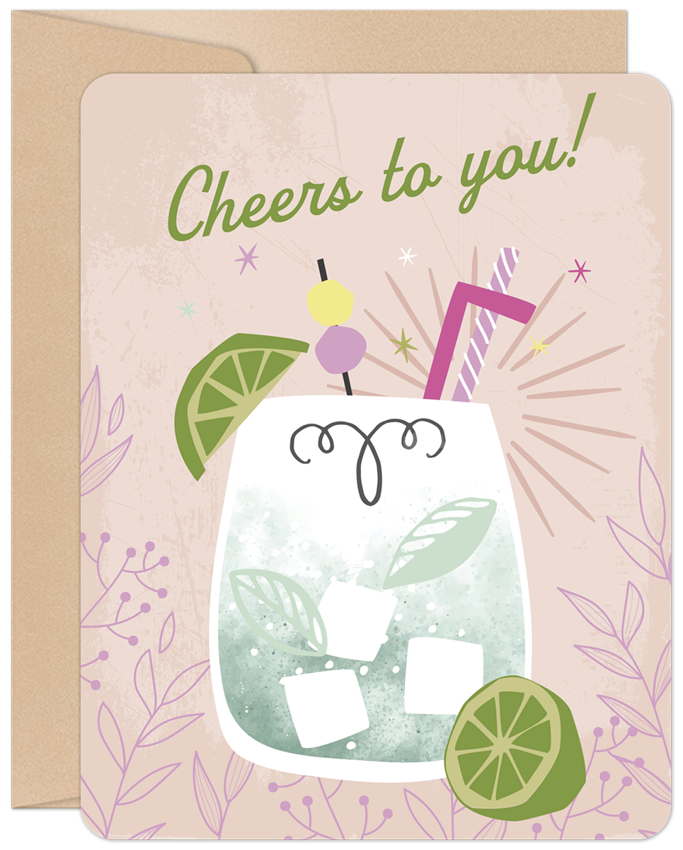 Front of a festive birthday greeting card featuring an illustrated cocktail glass with ice, lime slices, and a pink straw, surrounded by sparkling effects and the text 'Cheers to you!' on a soft pink background with subtle botanical details. Includes a brown envelope.