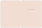 Inside of a light pink birthday greeting card with the simple green text 'HAPPY BIRTHDAY' centrally placed, showing ample space for a personalized message.
