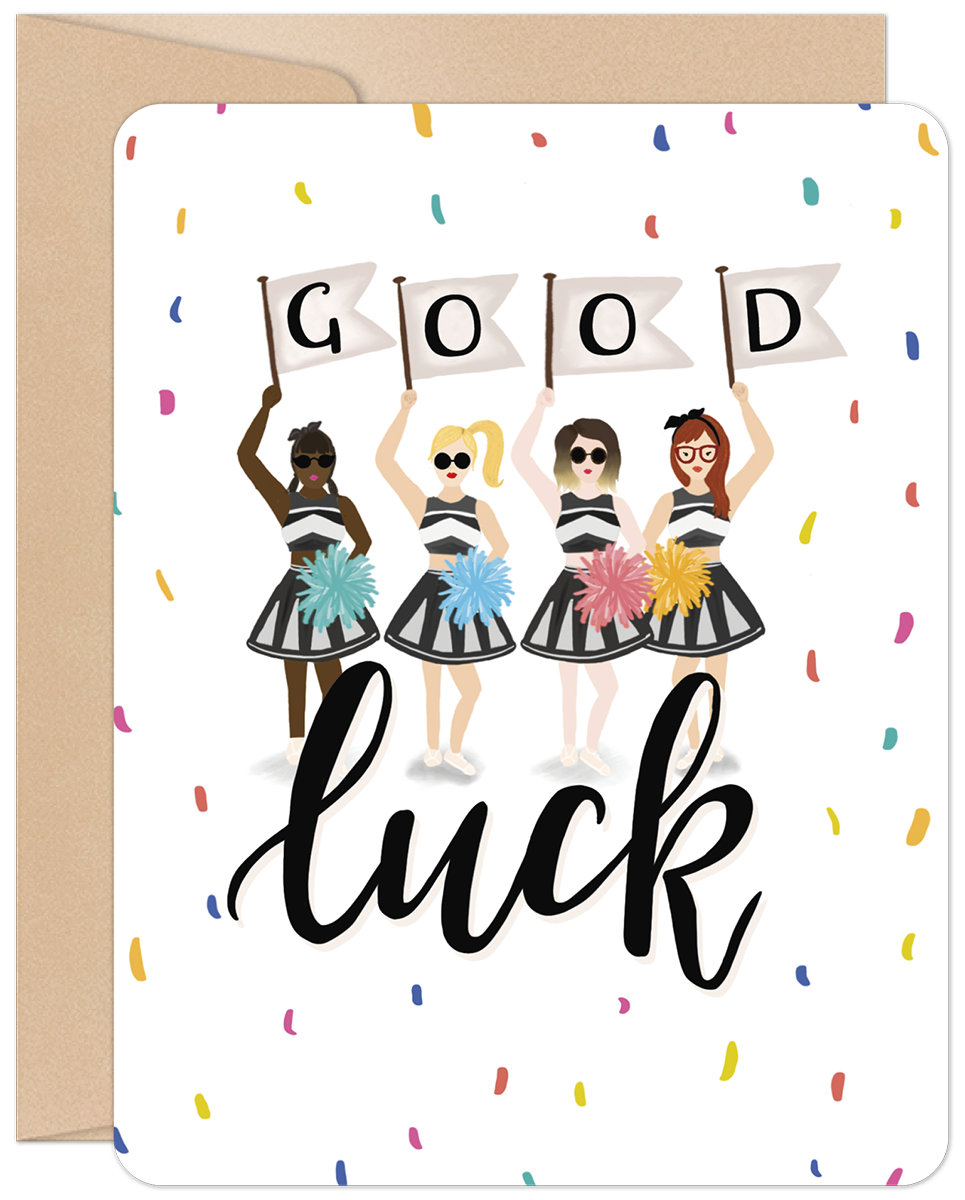Front of an encouraging greeting card featuring four diverse female cheerleaders in black and white striped outfits holding 'GOOD' flags and colorful pom-poms, surrounded by confetti, with 'luck' in script below. Perfect for friends embarking on new journeys.