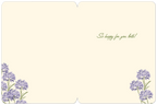 Interior of a wedding greeting card, light cream background with pre-printed message 'So happy for you both!' and delicate purple floral accents in the corners, providing ample space for a personal message.