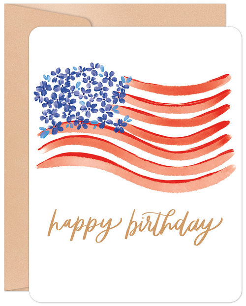 Watercolor American flag birthday card for her, featuring red stripes and blue floral 'stars' with gold 'happy birthday' calligraphy on a white background with a kraft envelope.