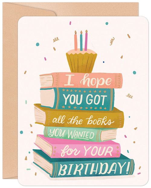 Front of a whimsical greeting card featuring a colorful stack of books with a cupcake and candles on top, surrounded by confetti. Text reads 'I hope you got all the books you wanted for your BIRTHDAY!'. Perfect for a book lover's special day.