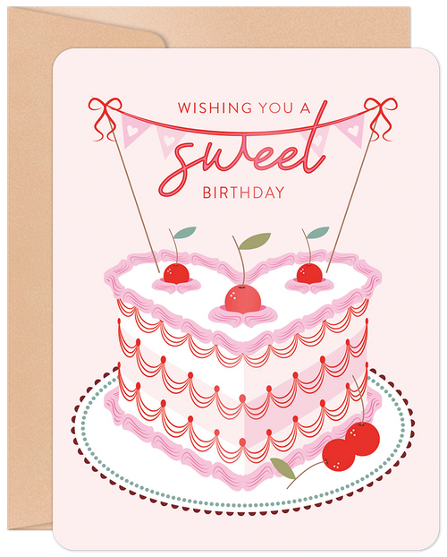 Romantic birthday greeting card with a heart-shaped pink cake, cherries, and 'Wishing you a sweet Birthday' banner on a light background with kraft envelope.