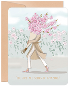 Vibrant uplifting greeting card for her featuring a stylish figure with a head of pink cherry blossoms, wearing a trench coat, walking through a garden with the uplifting message 'YOU ARE ALL SORTS OF AMAZING!' perfect for a friend.