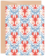 Front of a romantic greeting card featuring an intricate damask pattern of red lobsters, blue bows, golden stars, and pink seashells on a white background, with a brown kraft envelope.