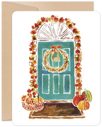 Watercolor illustration of a teal front door adorned with a golden wreath, vibrant autumn leaves, and pumpkins. A festive fall greeting card perfect for the harvest season.
