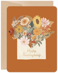 Elegant autumn floral greeting card featuring a bouquet of sunflowers, mums, and wildflowers in a rustic envelope, set against a warm orange background, perfect for expressing fall gratitude.