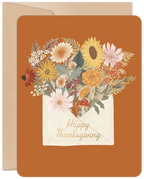 Elegant autumn floral greeting card featuring a bouquet of sunflowers, mums, and wildflowers in a rustic envelope, set against a warm orange background, perfect for expressing fall gratitude.