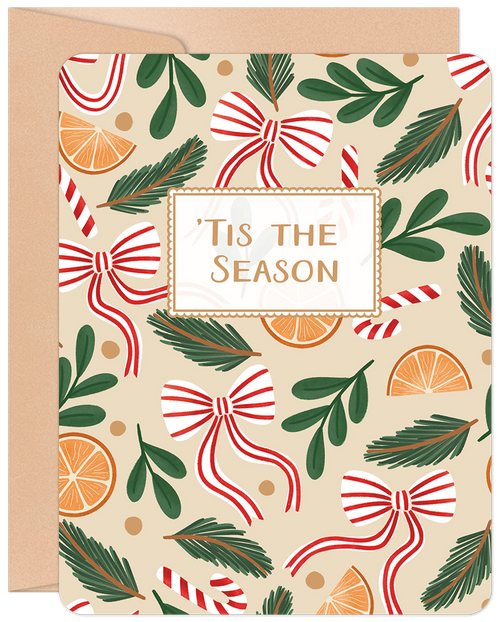 Festive lighthearted holiday greeting card with a whimsical pattern of red and white striped bows, candy canes, green pine needles, and orange slices on a cream background. The front reads 'Tis The Season' in a decorative frame.