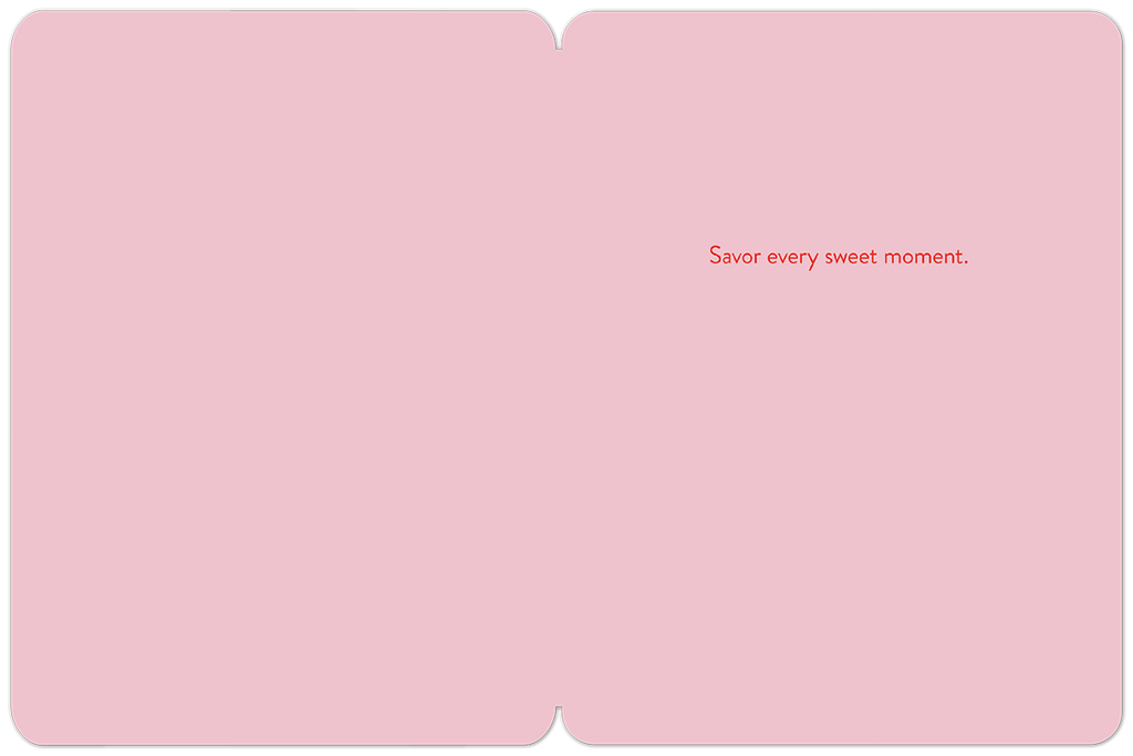 Inside of a pink greeting card with the message 'Savor every sweet moment.' in red script.