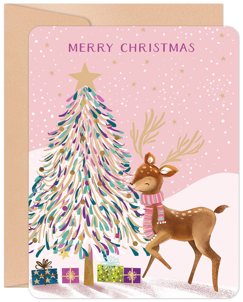 Cute pink Christmas greeting card featuring a fawn deer wearing a striped scarf next to a pastel-colored decorative tree with gifts, reading 'Merry Christmas'.