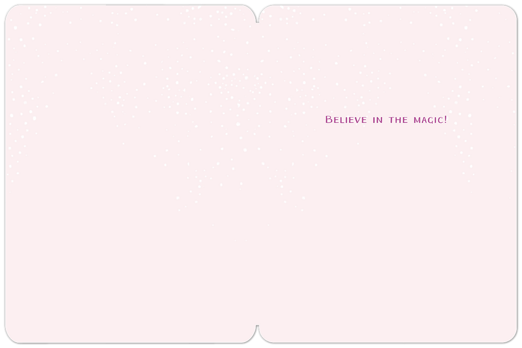Inside of a light pink holiday greeting card, subtly textured with falling snow, displaying the magical message 'BELIEVE IN THE MAGIC!' in purple script.