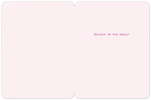 Inside of a cute pink Christmas greeting card with subtle white dots and the magical message 'Believe in the magic!'.