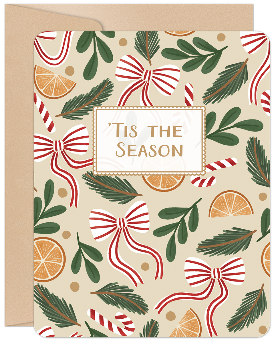 Front of a festive holiday greeting card featuring a pattern of red and white striped bows, candy canes, evergreen branches, and dried orange slices on a beige background. The card reads 'Tis the Season in the center, with a kraft paper envelope peeking from behind. Ideal for sending season's greetings.