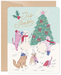 Cute illustration of dogs playing in a snowy winter scene around a decorated evergreen, building a snowman, perfect for festive greetings.