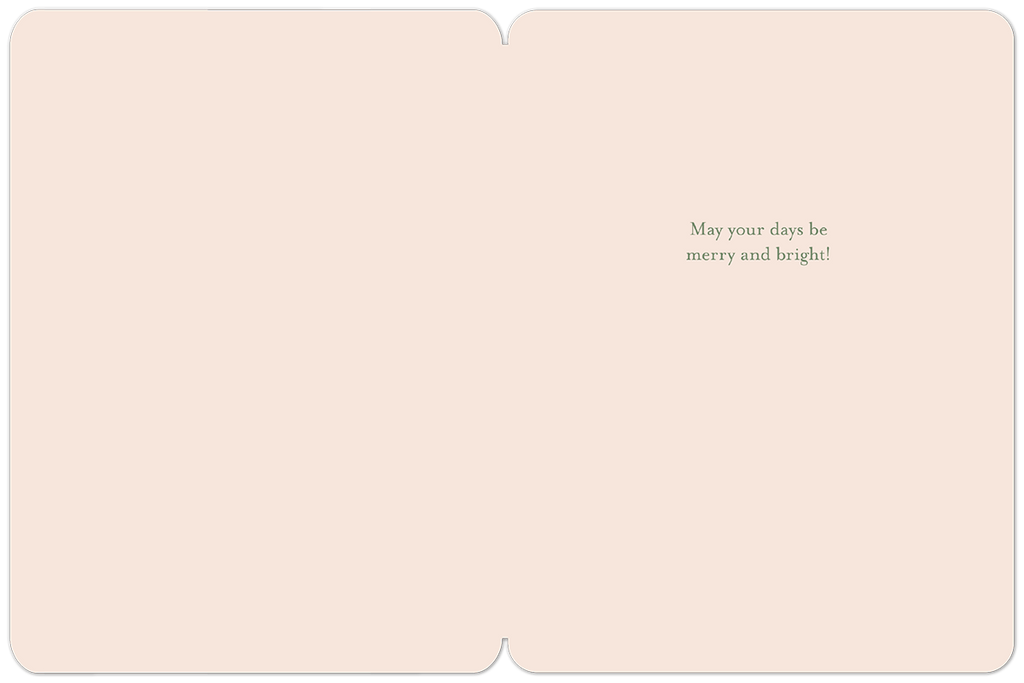 Inside view of an open seasonal greeting card with a soft pink interior, displaying the elegant green script 'May your days be merry and bright!'.