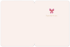 Inside of a blank holiday greeting card, showing a delicate pink bow graphic and 'Especially for you' text on a light pink background, ready for a personal message.