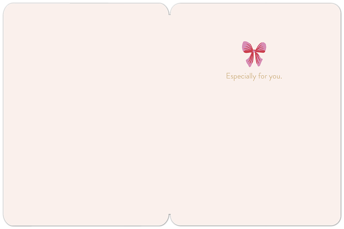 Inside of a blank holiday greeting card, showing a delicate pink bow graphic and 'Especially for you' text on a light pink background, ready for a personal message.