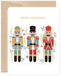 Nutcracker greeting card set front, festive holiday design, golden Merry Christmas text, whimsical figures, elegant seasonal stationery.