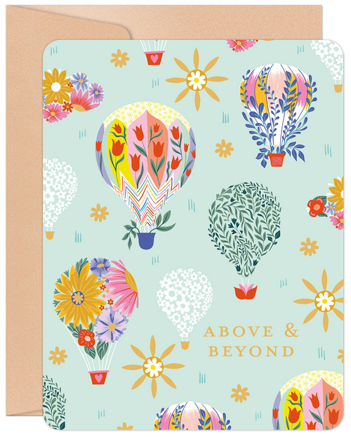 Front of a 'Above & Beyond' greeting card featuring vibrant, whimsical floral hot air balloons on a light mint green background, accompanied by a kraft envelope.